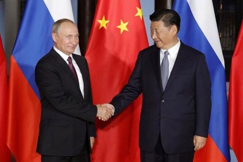 中国与俄罗斯加强在国际和地区问题上的合作 - ảnh 1