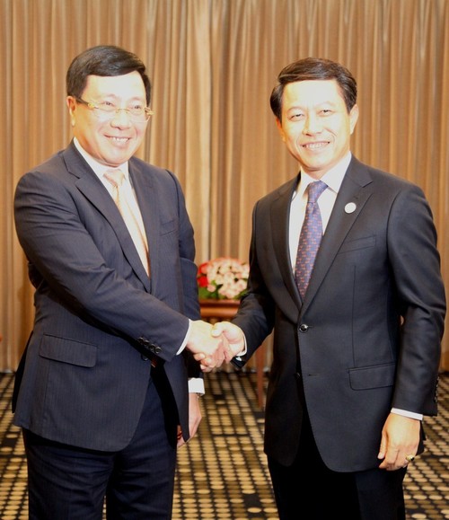 Le chef de la diplomatie vietnamienne rencontre ses homologues chinois et laotien - ảnh 1