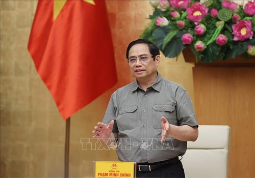 Pham Minh Chinh préside une réunion de la Direction nationale anti-Covid-19 - ảnh 1