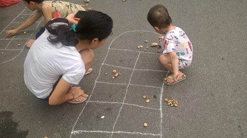 Воссоздание игры «О Ан Куан» на пешеходной улице Ханоя - ảnh 2