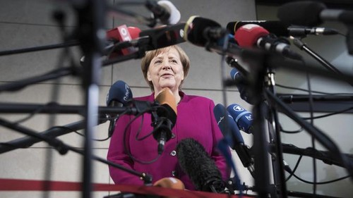  Angela Merkel ouvre «avec optimisme» les négociations pour former une majorité - ảnh 1
