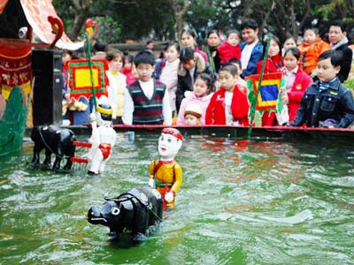 El teatro de las marionetas de agua, un arte peculiar de los Viet - ảnh 3