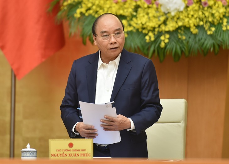 Primer ministro de Vietnam preside reunión ordinaria del Gobierno de diciembre - ảnh 1