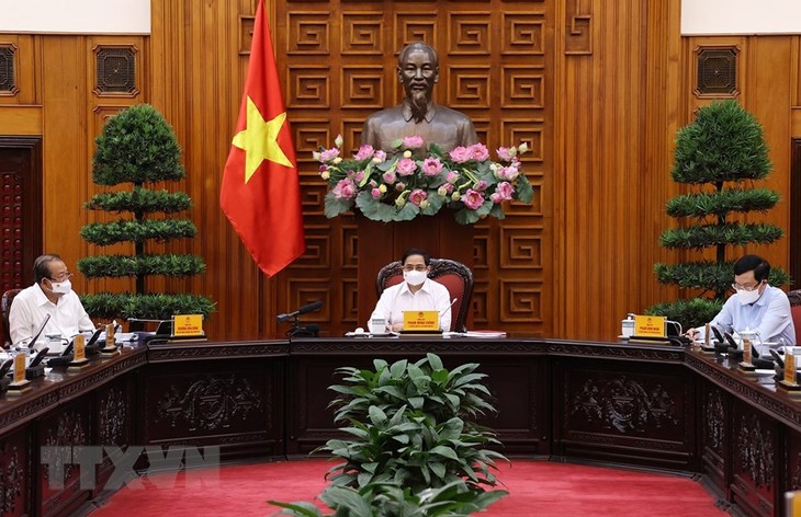 Reunión ordinaria del Gobierno vietnamita sobre el trabajo anticovid-19 - ảnh 1