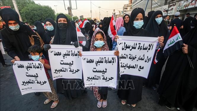 Caricatures de Mahomet : manifestation devant l'ambassade de France à Bagdad - ảnh 1