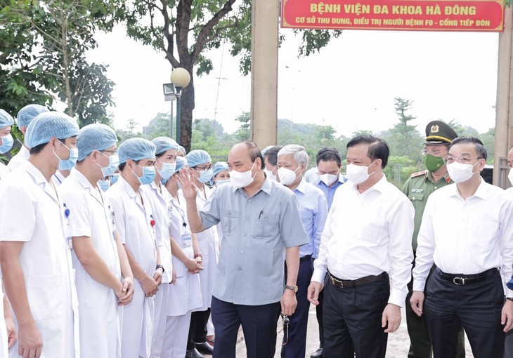 Staatspräsident Nguyen Xuan Phuc: Mit der Unterstützung des Volks können wir die Pandemie erfolgreich eindämmen - ảnh 1