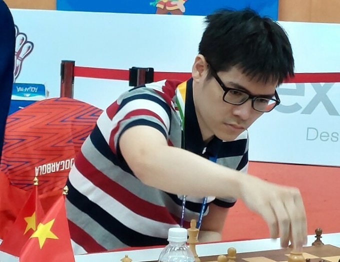 Le Tuan Minh ist der 13. Großmeister des vietnamesischen Schachspiels - ảnh 1