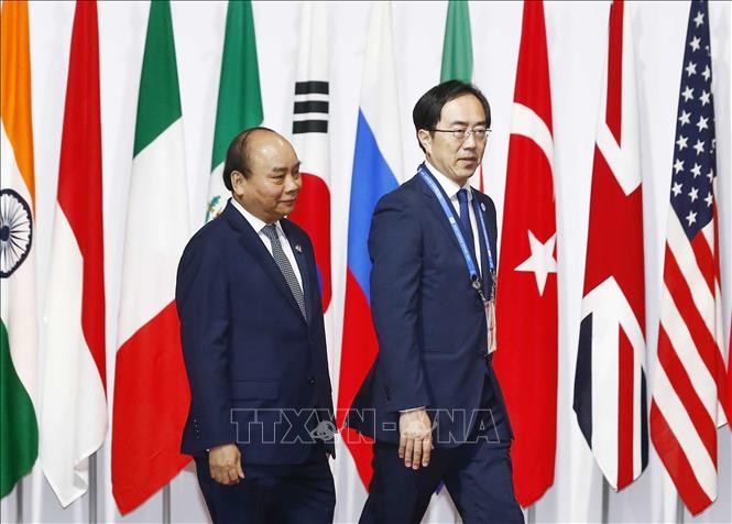 Премьер-министр Нгуен Суан Фук продолжил участие в саммите G20 в Осаке (Япония) - ảnh 1