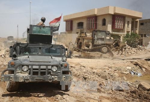 Pasukan-pasukan Irak membebaskan daerah di sekitar di Mosul Barat Laut - ảnh 1