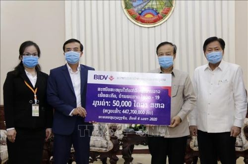 Badan usaha Vietnam membantu Laos melawan wabah Covid-19 - ảnh 1