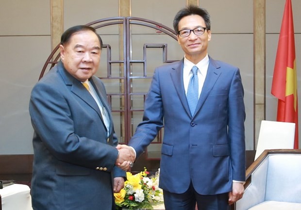 Deputi PM Vu Duc Dam Terima Deputi PM Merangkap Ketua Komite Olimpiade Nasional Thailand - ảnh 1