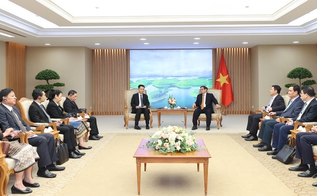 PM Vietnam, Pham Minh Chinh Menerima Menteri Industri dan Perdagangan Laos, Malaythong Kommasith     - ảnh 1