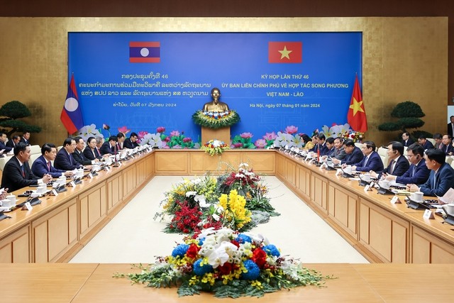 PM Vietnam, Pham Minh Chinh dan PM Laos, Sonexay Siphandone Bersama-Sama Pimpin Sidang AntarPemerintah Vietnam-Laos - ảnh 1