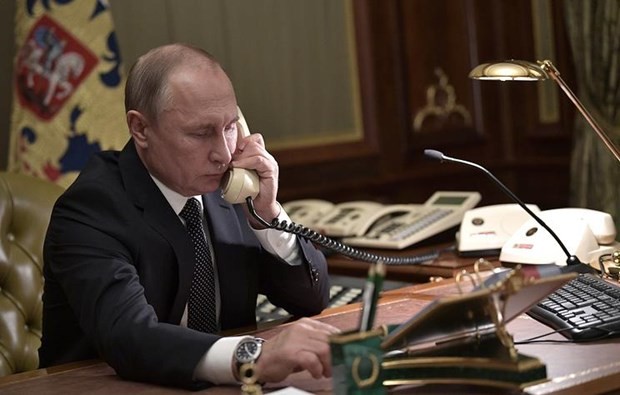 Putin, Merkel and Macron discuss hot issues by phone - ảnh 1