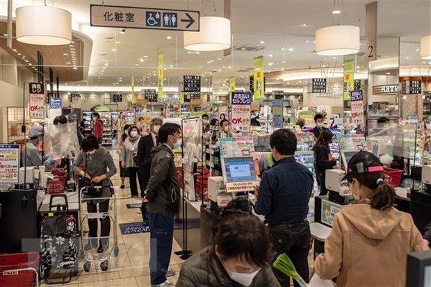 Japan's economy grows 12.7% in Q4 despite COVID -19  - ảnh 1