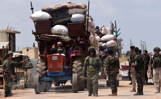 Suriah: Kira-kira 300 kaum pembangkan datang kawasan mengurangi ketegangan - ảnh 1