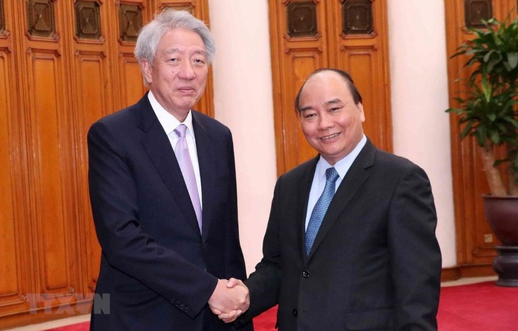 PM Nguyen Xuan Phuc menerima Deputi PM Singapura - ảnh 1