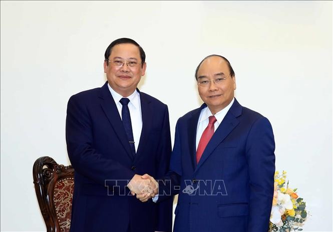 PM Nguyen Xuan Phuc Menerima Deputi PM, Menteri Perencanaan dan Investasi Laos - ảnh 1