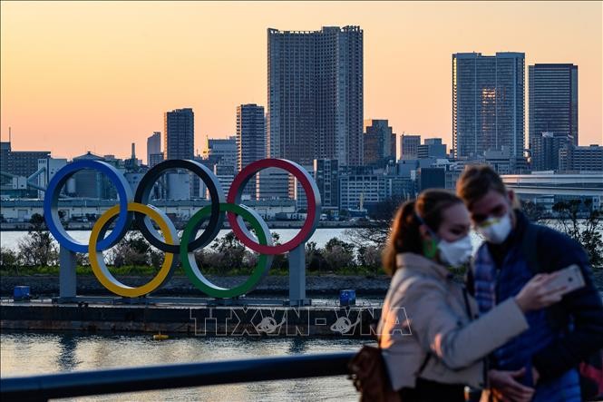 PM Jepang untuk pertama kalinya mengungkapkan kemungkinan menunda Olimpiade Tokyo 2020. - ảnh 1
