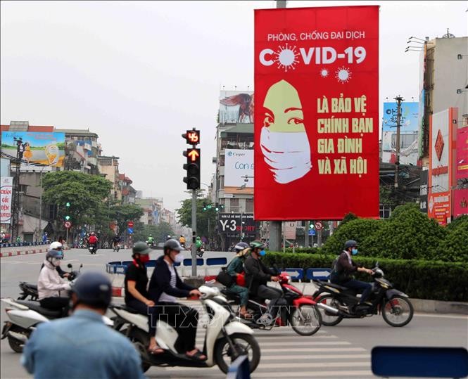 Media asing menonjolkan pengalaman melawan wabah secara sukses dari Vietnam - ảnh 1
