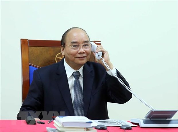 PM Nguyen Xuan Phuc melakukan pembicaraan telepon dengan Pemimpin Grup Permigasan Exxon Mobil - ảnh 1