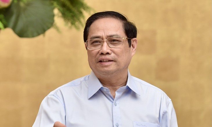PM Pham Minh Chinh Canangkan Gerakan Kompetisi Khusus untuk Menangkan Pandemi Covid-19 - ảnh 1