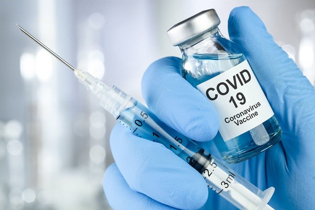 Perdana Menteri Putuskan Tambah Alokasi Pembelian Vaksin Pencegah Covid 19 - ảnh 1