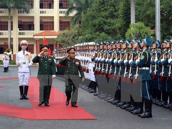 Vietnam, Laos sign defense cooperation plan - ảnh 1
