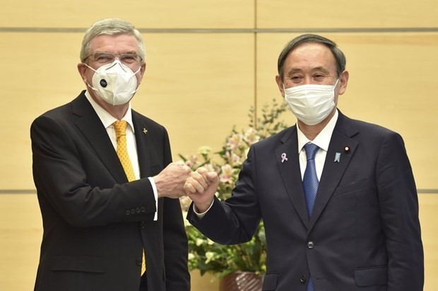 Japan, IOC agree to organize Olympic Tokyo as planned - ảnh 1