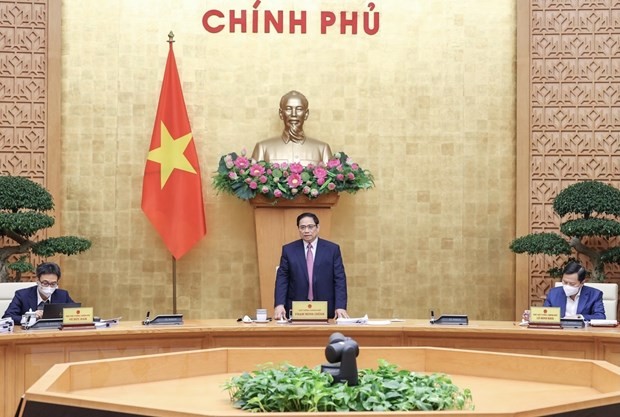 PM presides over government meeting on law building - ảnh 1