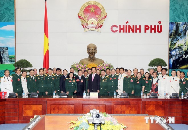 Le Premier ministre Nguyen Tan Dung rencontre des anciens combattants exemplaires  - ảnh 1