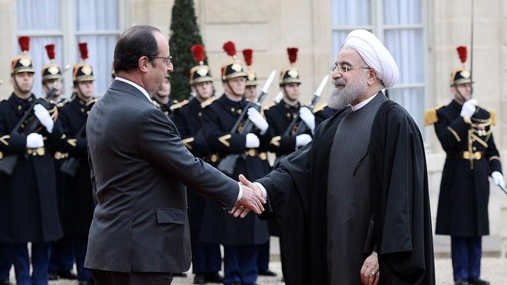 À Paris, Rohani relance la coopération franco-iranienne - ảnh 1