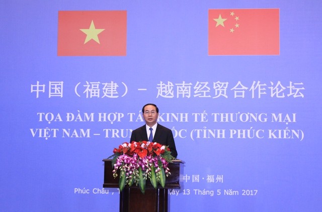 Tran Dai Quang à la table ronde sur la coopération commerciale Vietnam-Chine - ảnh 1
