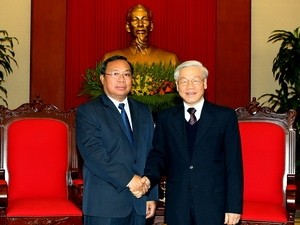 Sekjen Nguyen Phu Trong menerima delegasi tingkat tinggi Partai Rakyat Revolusioner Laos - ảnh 1