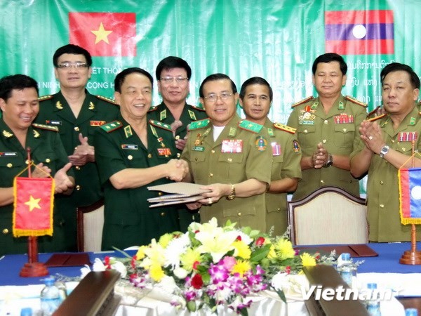 Vietnam dan Laos membangun pola kebijakan satu pintu - ảnh 1
