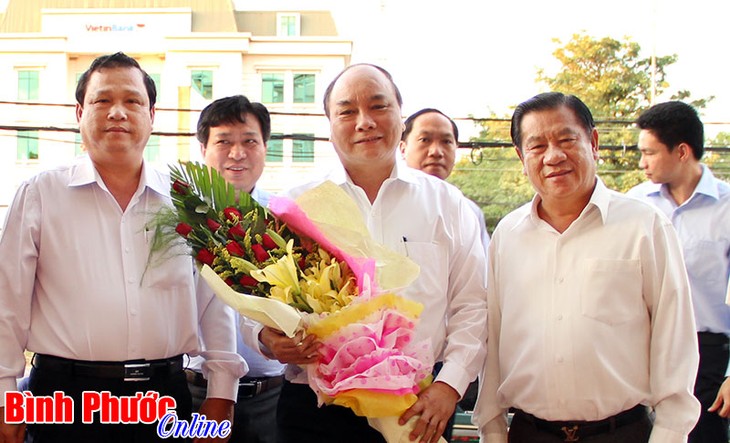 Deputi PM Nguyen Xuan Phuc mengunjungi provinsi Binh Phuoc - ảnh 1