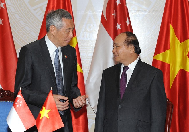Memperkuat hubungan kemitraan strategis Vietnam-Singapura di semua bidang - ảnh 1