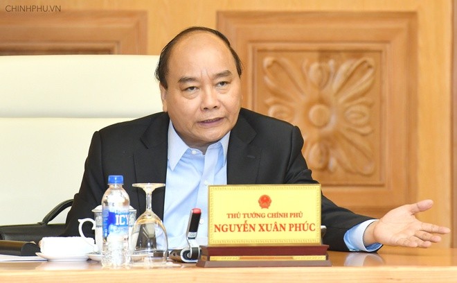 PM Nguyen Xuan Phuc memimpin sidang Pemerintah tentang wabah Covid-19 - ảnh 1