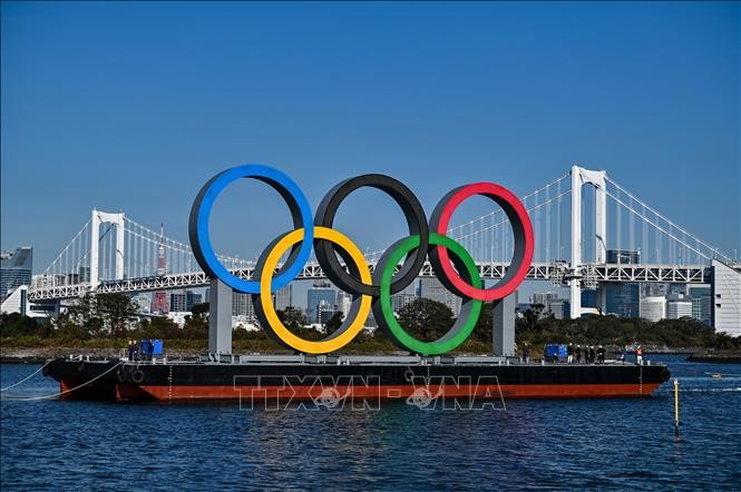 ຍີ່​ປຸ່ນ ຊັ່ງ​ຊາ​ເລື່ອງ​ຈຳ​ກັດ​ຈຳ​ນວນ​ຜູ້​​ເຂົ້າ​ຊົມ​ງານ​ມະ​ຫາ​ກຳ​ກິ​ລາລະ​ດູ​ຮ້ອນ Olympics Tokyo ​ໃນ​ສະ​ໜ​າມ​ກິ​ລາ - ảnh 1
