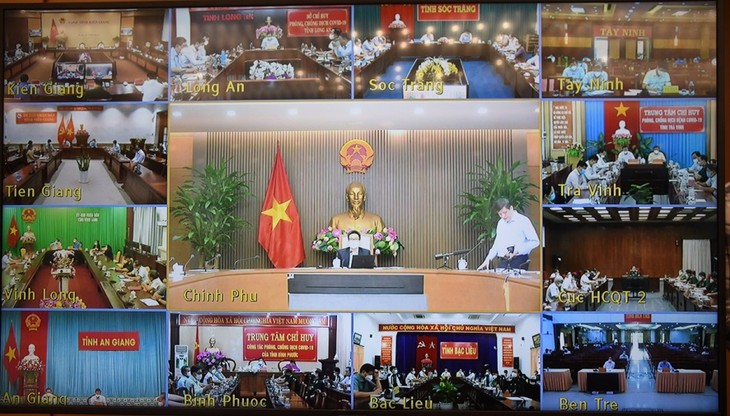Vietnam persiste en controlar estrictamente el covid-19, afirma el vicepremier Vu Duc Dam - ảnh 1