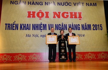 Bank Negara Vietnam berupaya  agar alat pembayaran naik  16-18%  dan kredit naik13-15% pada tahun 2015   - ảnh 1