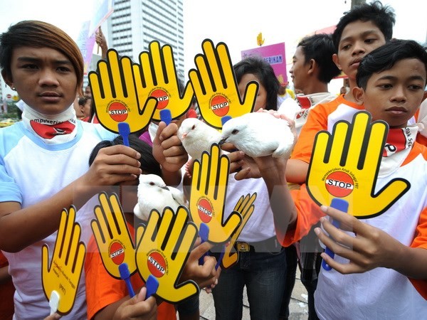 ASEAN mendorong  dan membela hak-hak  kaum wanita dan anak-anak. - ảnh 1