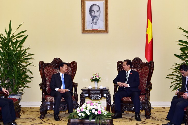 PM Vietnam, Nguyen Tan Dung menerima Deputi PM Laos, Somsavat Lengsavad - ảnh 1