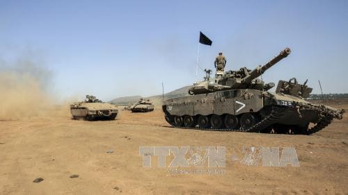 Israel melepaskan tembakan peringatan  terhadap satu pangkalan tentara Suriah - ảnh 1