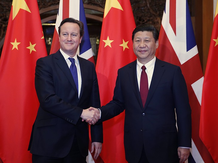 中国国家主席习近平会见英国首相卡梅伦 - ảnh 1