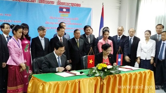 越南和老挝签署双边贸易协定 - ảnh 1