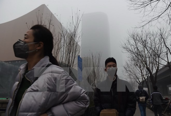中国多座城市发布空气严重污染预警 - ảnh 1