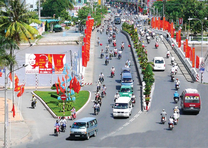 龙川市无愧为九龙江平原地区的城市典范 - ảnh 1