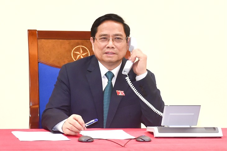 越南新任政府总理范明正与老挝总理、柬埔寨首相通电话 - ảnh 1