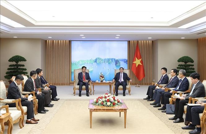 越南政府总理范明政会见老挝司法部长佩维 - ảnh 1